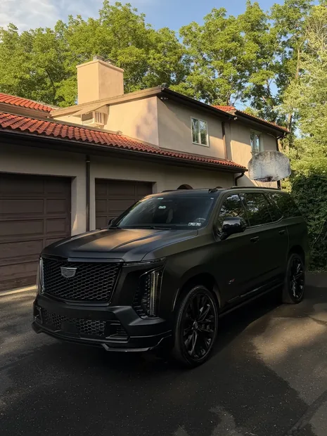 Matte black Cadillac Escalade V after an exterior detail